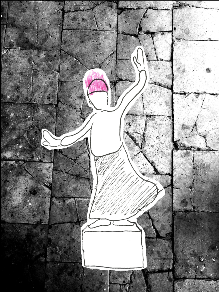 Figurine de papier, dessinée, posé sur le sol, représentant un bonhomme sur une stèle.